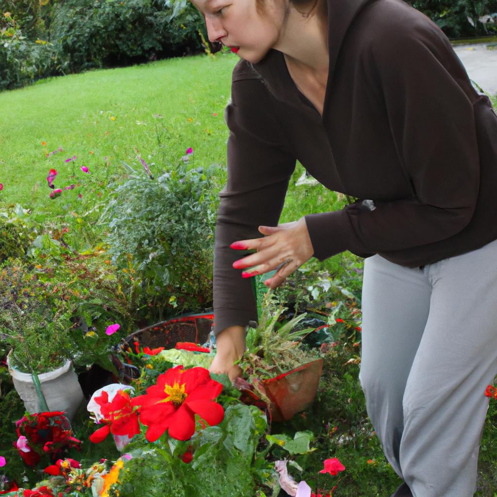 Woman arranging flowers in garden